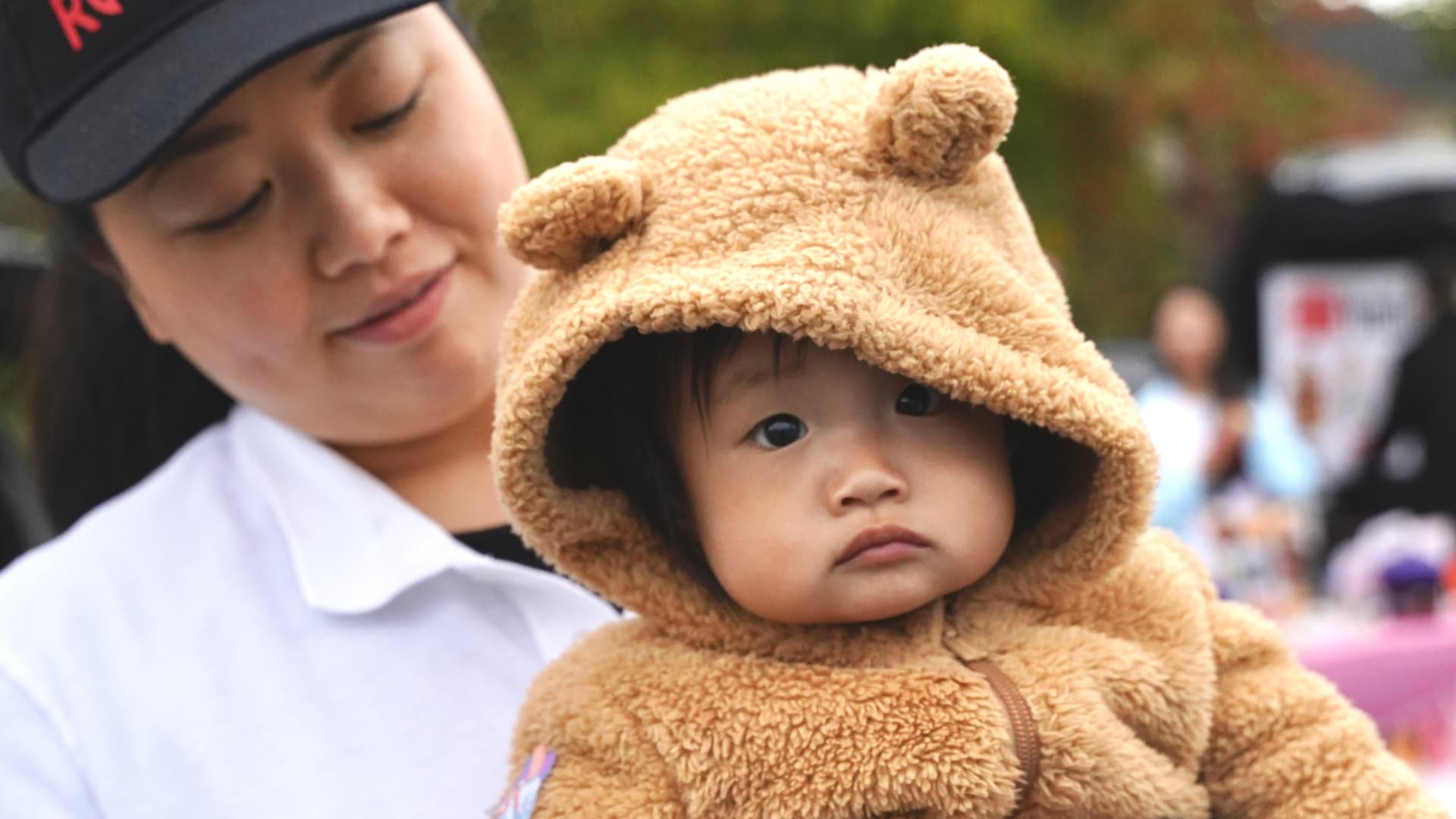 A young child with a volunteer at a Crossroads gathering