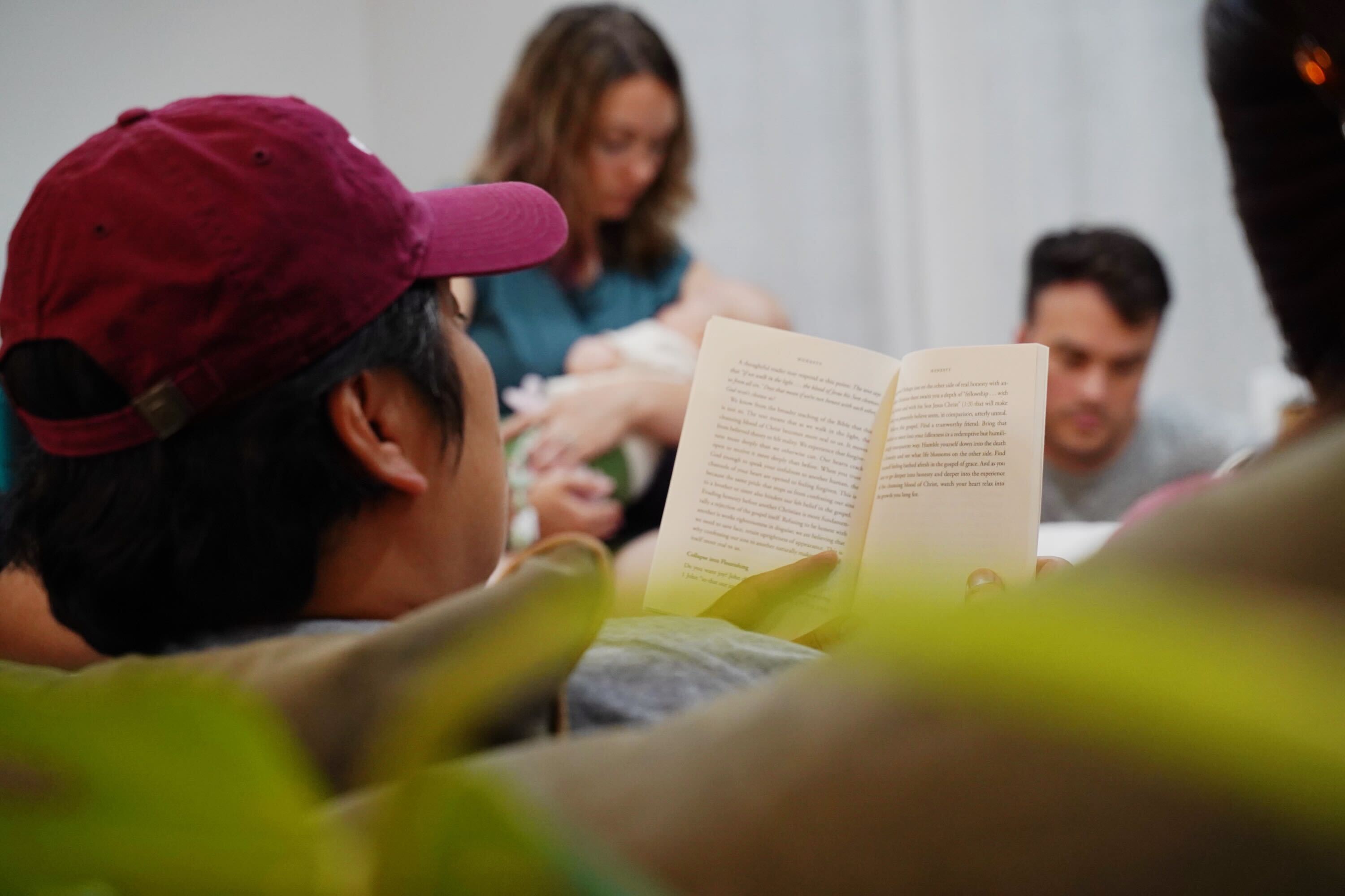 Members of a community group praying together